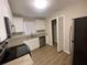 Renovated kitchen with granite countertops and stainless steel appliances at 2490 Brentwood Rd, Decatur, GA 30032
