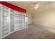 Bedroom with built-in shelving and an accent wall at 678 Emeril Dr, Avondale Estates, GA 30002