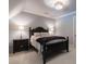 Charming bedroom with a black wooden bed frame and nightstands at 101 Morgan Ln, Canton, GA 30115