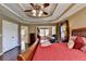 Main bedroom with hardwood floors and tray ceiling at 1741 Mulberry Lake Dr, Dacula, GA 30019