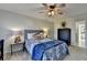 Bedroom with blue bedding and ceiling fan at 1741 Mulberry Lake Dr, Dacula, GA 30019