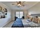 Bedroom with blue bedding and ceiling fan at 1741 Mulberry Lake Dr, Dacula, GA 30019