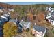 Aerial view showcasing a neighborhood with houses and lush green trees at 260 Wildcat Lake Dr, Lawrenceville, GA 30043