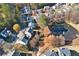 Aerial view of house and neighborhood, showcasing a pond at 260 Wildcat Lake Dr, Lawrenceville, GA 30043