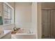 Bathroom with a soaking tub and a separate shower stall at 260 Wildcat Lake Dr, Lawrenceville, GA 30043