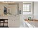 Bathroom with a double vanity, a soaking tub, and a large mirror at 260 Wildcat Lake Dr, Lawrenceville, GA 30043