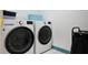 Laundry room with washer, dryer, and storage at 260 Wildcat Lake Dr, Lawrenceville, GA 30043