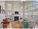 Spacious living room with hardwood floors, fireplace, and wall-to-wall windows at 260 Wildcat Lake Dr, Lawrenceville, GA 30043