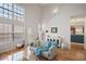 Spacious living room with hardwood floors, high ceilings, and access to a deck at 260 Wildcat Lake Dr, Lawrenceville, GA 30043