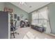 Home office with a large window, built-in shelving, and desk at 260 Wildcat Lake Dr, Lawrenceville, GA 30043