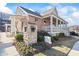 Brick community clubhouse with a porch and landscaping at 4113 Barry Pl, Atlanta, GA 30341