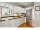 Modern kitchen with stainless steel appliances and white cabinetry at 1046 Ormewood Se Ave, Atlanta, GA 30316