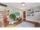 Open living room with hardwood floors and a view into the kitchen and dining area at 1046 Ormewood Se Ave, Atlanta, GA 30316