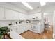 Bright white kitchen with ample counter space and updated appliances at 15 Downshire Ln, Decatur, GA 30033