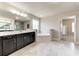 Luxurious bathroom featuring a large soaking tub and double vanity at 571 Wagon Hill Ln, Sugar Hill, GA 30518