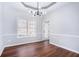 Formal dining room with hardwood floors, chandelier, and chair rail at 739 Reeves Lake Sw Dr, Marietta, GA 30064