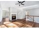 Living room with hardwood floors, fireplace, and access to other rooms at 739 Reeves Lake Sw Dr, Marietta, GA 30064