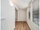 Bright entryway with wood-look floors, white brick accent wall, and access to other rooms at 2941 Caldwell Ne Rd # B5, Brookhaven, GA 30319