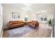 Living room with brown leather sofas and a rug at 5689 Greensage Dr, Atlanta, GA 30349