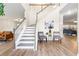 Elegant staircase with gray railing and light-colored risers at 5689 Greensage Dr, Atlanta, GA 30349