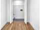 Bright laundry room with wood-look floors and built-in shelving at 3070 Branford Ct, Marietta, GA 30062