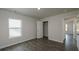 Simple bedroom with dark wood-look flooring and a large window and closet at 4074 Fairlady Ct, Kennesaw, GA 30144