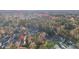 Aerial view of homes and fall foliage in a wooded area at 100 Parkside Dr, Fayetteville, GA 30214