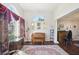 Living room with hardwood floors, piano, and large windows at 100 Parkside Dr, Fayetteville, GA 30214