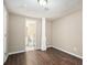 Bright bedroom with dark brown tile floors and access to a bathroom at 2991 The Meadows Way, Atlanta, GA 30349