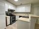 Kitchen with stainless steel appliances and light wood cabinets at 1086 Heathmoor Ct, Norcross, GA 30093