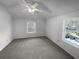 Bright bedroom with neutral carpet and two large windows at 4279 Orchard Grv, Stone Mountain, GA 30083