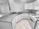 Kitchen with white cabinets and a double sink at 4279 Orchard Grv, Stone Mountain, GA 30083