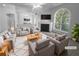 Virtually staged living room featuring a fireplace and large window at 4279 Orchard Grv, Stone Mountain, GA 30083