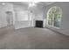 Spacious living room with a fireplace and ample natural light at 4279 Orchard Grv, Stone Mountain, GA 30083