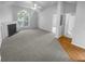 Spacious living room with fireplace and large window at 4279 Orchard Grv, Stone Mountain, GA 30083