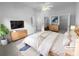 Virtually staged main bedroom with a king-size bed and walk-in closet at 4279 Orchard Grv, Stone Mountain, GA 30083
