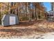 Private backyard with shed and wooded area at 2326 Chestnut Log Dr, Lithia Springs, GA 30122