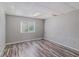 Bright basement room with window and wood flooring at 2326 Chestnut Log Dr, Lithia Springs, GA 30122