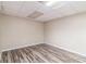 Spacious finished basement with wood-look flooring at 2326 Chestnut Log Dr, Lithia Springs, GA 30122