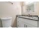 Updated bathroom with granite countertop and white cabinets at 2326 Chestnut Log Dr, Lithia Springs, GA 30122