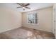 Simple bedroom with neutral walls and carpet flooring at 2326 Chestnut Log Dr, Lithia Springs, GA 30122