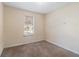 Small bedroom with neutral walls and carpet flooring at 2326 Chestnut Log Dr, Lithia Springs, GA 30122
