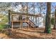 House exterior with deck and wooded backyard at 2326 Chestnut Log Dr, Lithia Springs, GA 30122