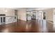 Open concept living area with hardwood floors and kitchen view at 2326 Chestnut Log Dr, Lithia Springs, GA 30122