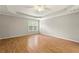 Large bedroom with hardwood floors and ceiling fan at 5279 Monarch Pine Ln, Peachtree Corners, GA 30071