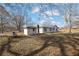 Backyard view of house with detached shed and propane tank at 2948 Lenora Rd, Snellville, GA 30039