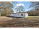 Large white outbuilding or workshop with multiple doors at 2948 Lenora Rd, Snellville, GA 30039