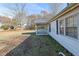 Side view of house exterior with covered porch and some landscaping at 2948 Lenora Rd, Snellville, GA 30039