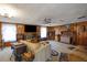 Cozy living room with wood paneling, fireplace, and vintage furniture at 2948 Lenora Rd, Snellville, GA 30039