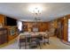 Living area with wood-paneled walls, fireplace, and various vintage decor at 2948 Lenora Rd, Snellville, GA 30039
